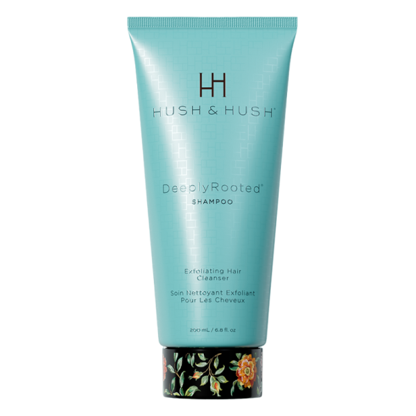 HUSH & HUSH DeeplyRooted Shampoo, 200 ml, exfolierendes Haarreinigungsmittel in türkisfarbener Tube mit floralem Design am Boden.