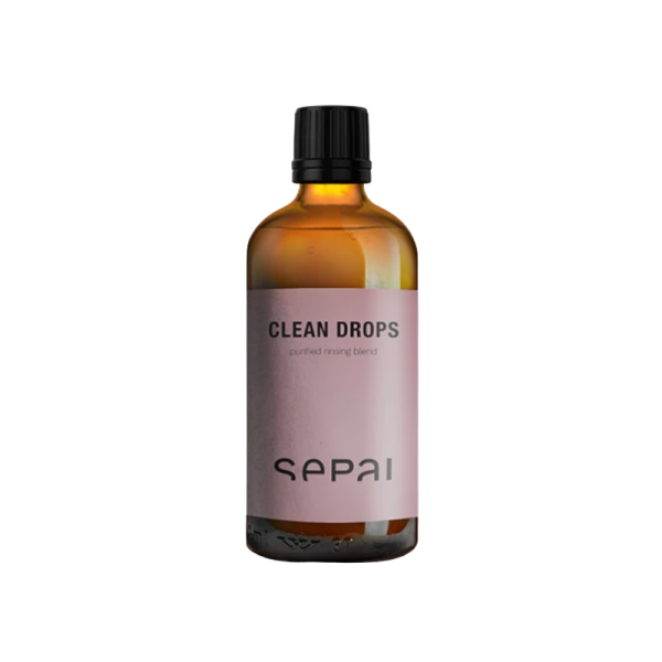 Braune Glasflasche mit schwarzem Deckel und rosa Etikett, beschriftet mit 'Clean Drops' und 'Sepai'.