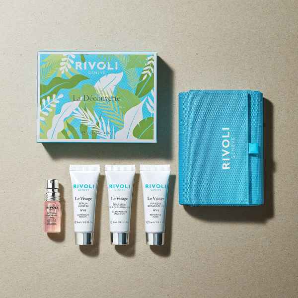 Rivoli Genéve Discovery Set: Box, drei Tuben, ein Fläschchen und eine blaue Tasche auf beigem Hintergrund.