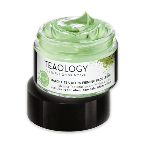 Matcha Tea Ultra-Firming Gesichtscreme von Teaology, 50ml, geöffneter Tiegel mit grüner Creme auf schwarzem Deckel.