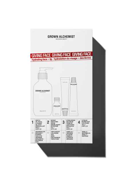 Grown Alchemist Hautpflege-Set 'Giving Face' mit Gesichts- und Lippenpflegeprodukten in weißer Verpackung mit rotem Text und Schatten.