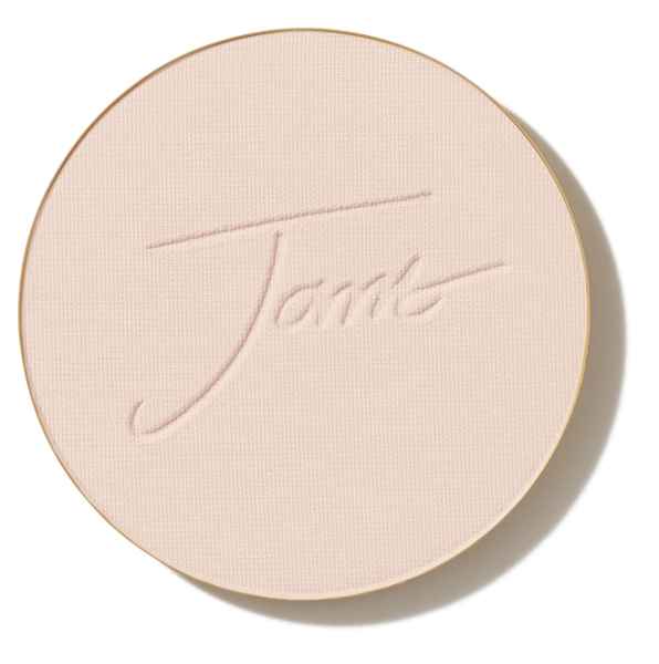 Runde, beige Puderdose mit der Aufschrift 'Jane'.