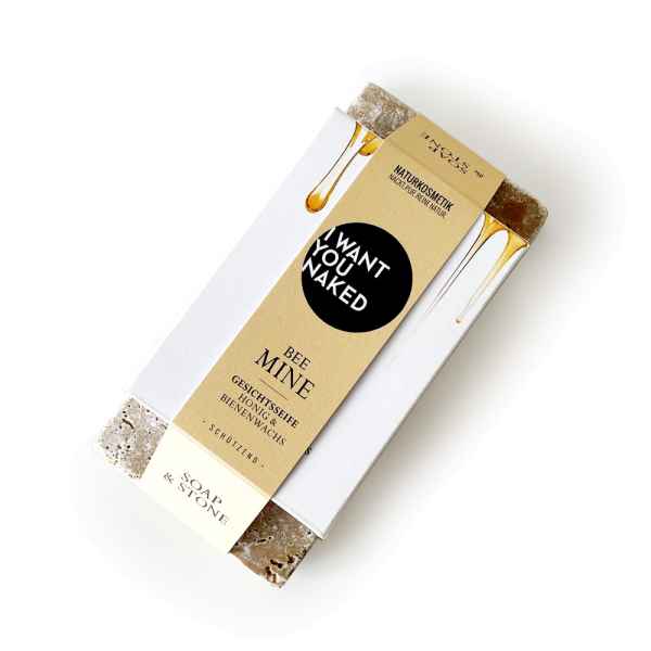 Handgemachte Gesichtsseife 'Bee Mine' von Soap & Stone, verpackt in weißem Papier mit Bienenwachs und Honig.