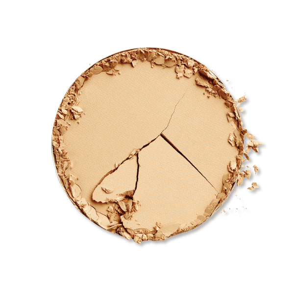 Zerbrochener, beiger Bronzer auf schwarzem Hintergrund.