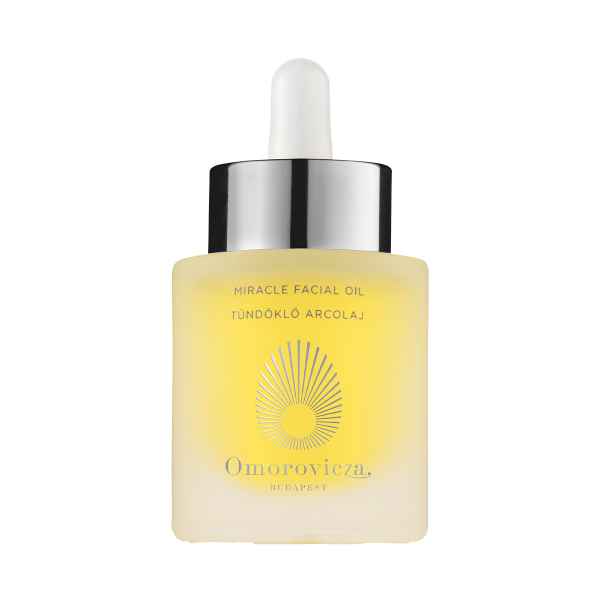 Flasche Omorovicza Miracle Facial Oil mit Pipette, gelbe Flüssigkeit, silberner Deckel, ungarischer Text auf der Flasche.