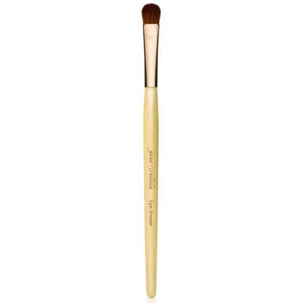 Jane Iredale Eye Shader Pinsel mit hellem Holzgriff und braunen Borsten.