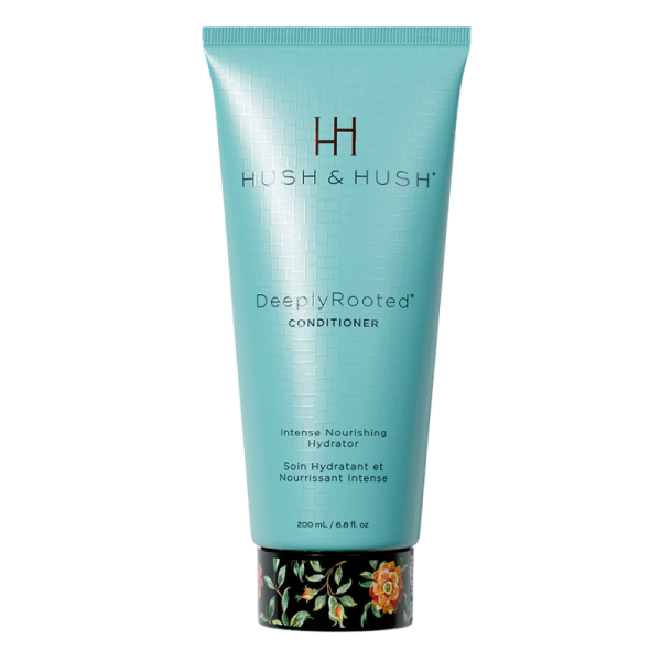 Hush & Hush DeeplyRooted Conditioner, 200 ml, intensiver nährender Hydrator in türkisfarbener Tube mit floralem Design am Boden.