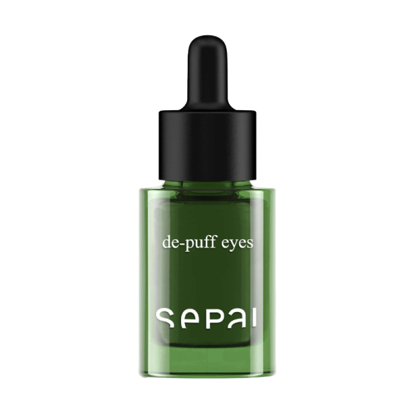 Grüne Flasche mit Pipette, beschriftet mit 'de-puff eyes' und 'SEPAI'.