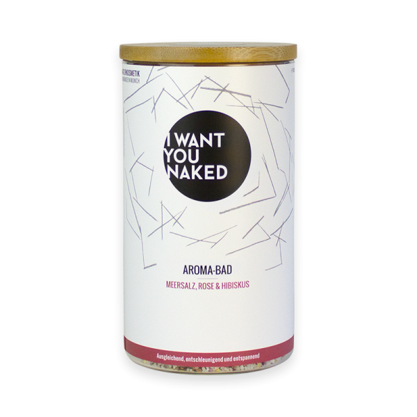 Dose mit Meersalz-Rose-Hibiskus-Aromabad von 'I Want You Naked' auf weißem Hintergrund.