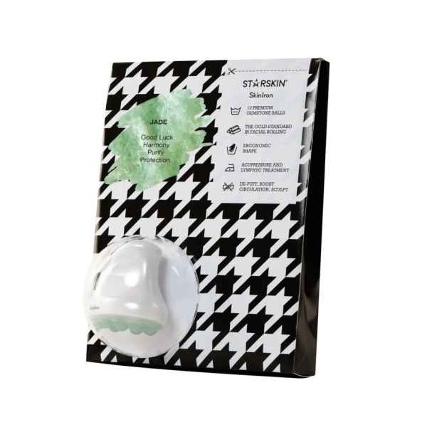 Verpackung eines Jade-Gesichtsmassagegeräts von STARSKIN auf schwarz-weißem Hintergrund.
