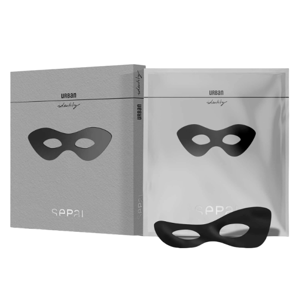 Produktbild von URBAN identity: Verpackung, Maske und Beutel mit schwarzer Augenmaske auf grauem Hintergrund.