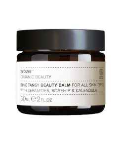 Evolve Organic Beauty Blue Tansy Beauty Balm für alle Hauttypen, 60ml, in einem braunen Glasbehälter.
