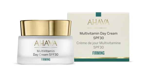 AHAVA Multivitamin Day Cream SPF30 in weißem Tiegel mit goldfarbenem Deckel, Verpackung im Hintergrund.