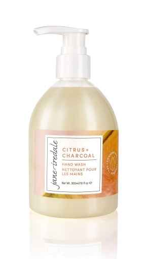 Jane Iredale Citrus + Charcoal Handseife, 305 ml, in einer durchsichtigen Pumpflasche mit Etikett.