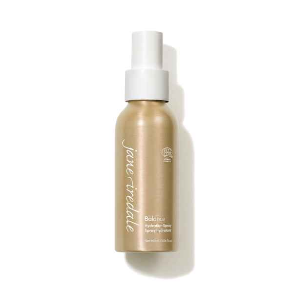 Jane Iredale Balance Hydration Spray in goldener Flasche mit weißem Sprühkopf, 90 ml.