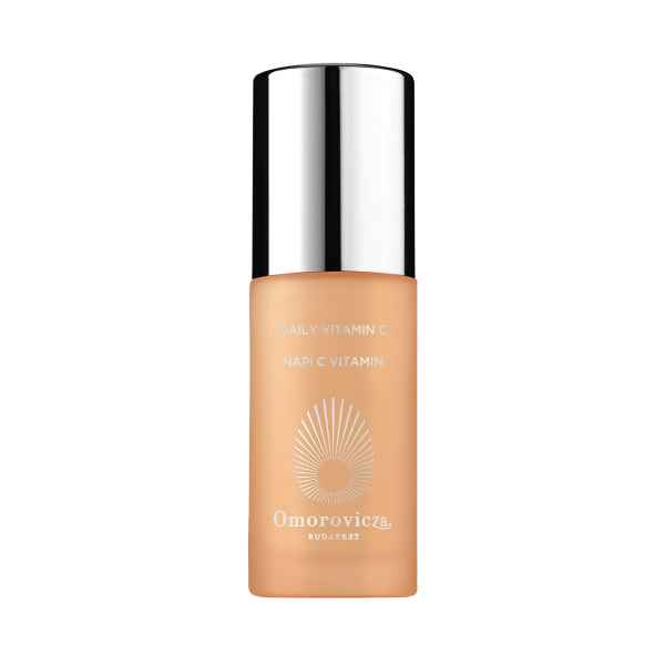 Flasche Omorovicza Daily Vitamin C Serum mit silbernem Deckel und orangefarbenem Etikett.