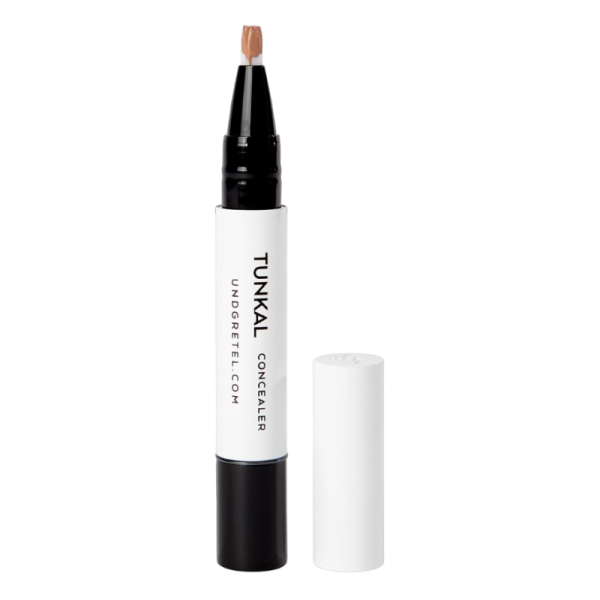 UND GRETEL TUNKAL Concealer in der Farbe 5 Honey Beige mit abgenommenem Deckel.